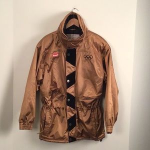 Vintage winter Olympic parka, with hidden hood in collar. Size M. Copper color.